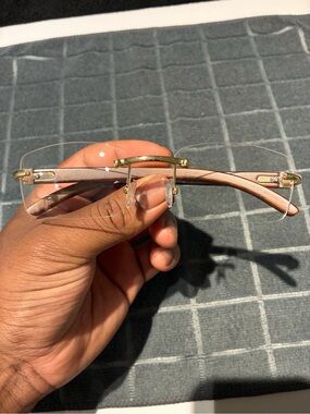 Rimless Men's Eyeglasses with Pink Temples and Gold Accents